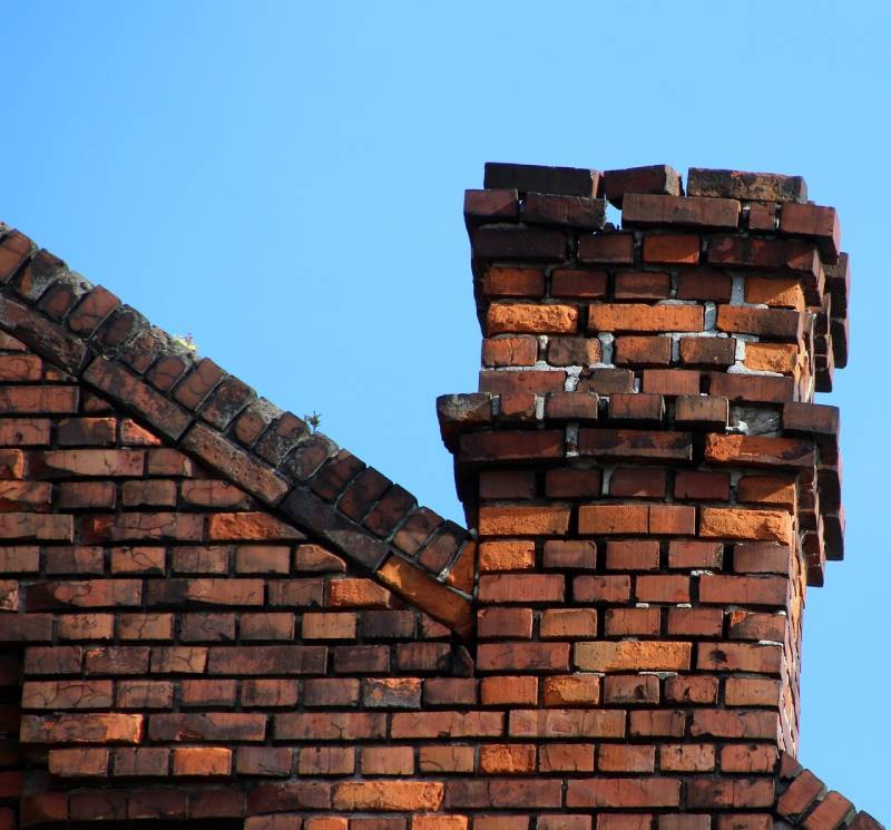 Damaged chimney on an Boyds home showing cracks and missing mortar